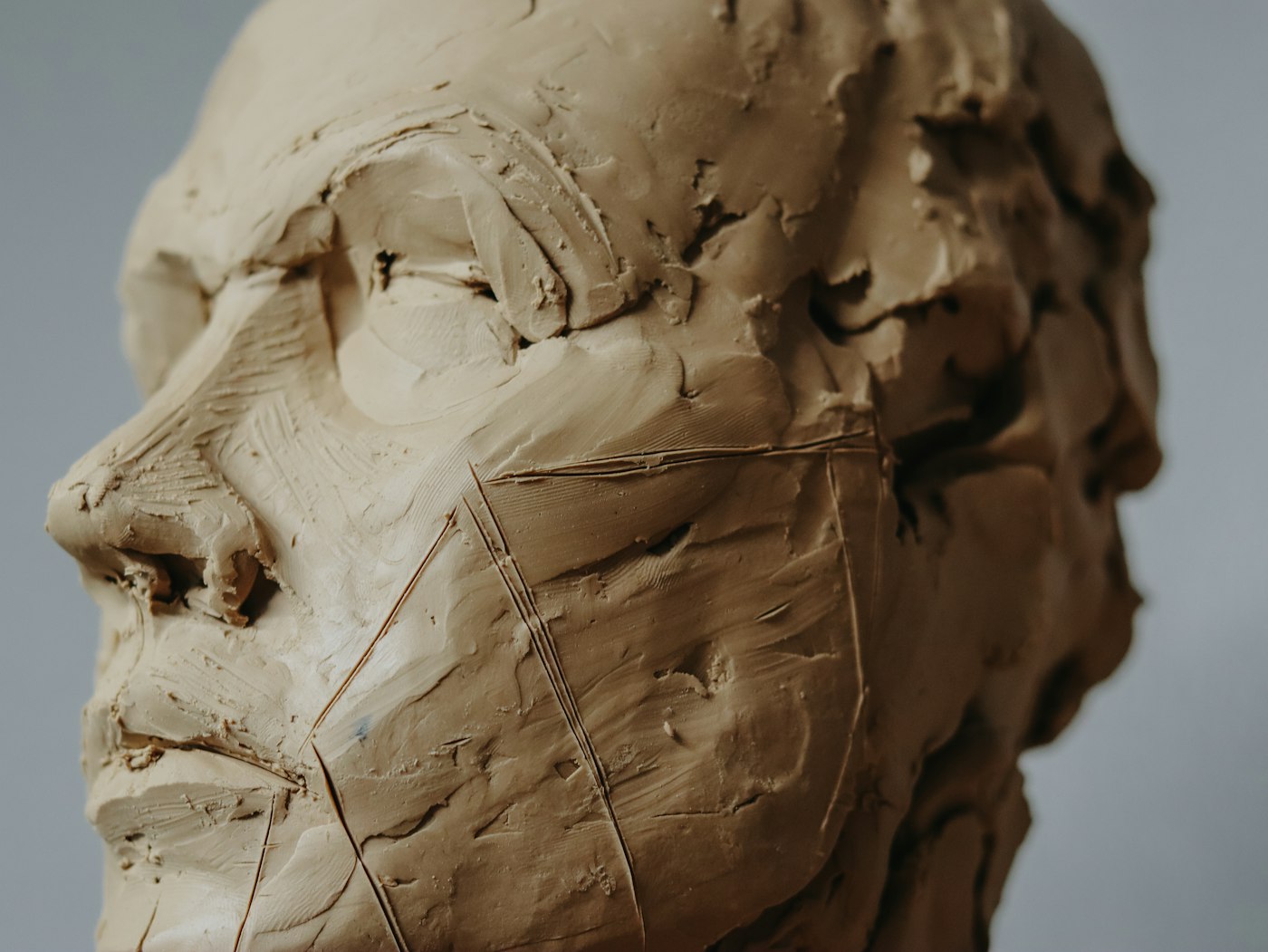 an unfinished male portrait sculpture from life
